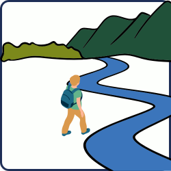 A man walking along a river