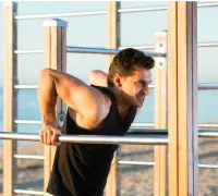 Bar dip exercises A man doing bar dip