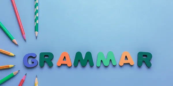 Colorful wooden letters spelling the word GRAMMAR