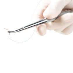 A surgeon holding a needle with a needle holder