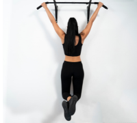 A woman using pull-up bar