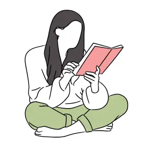 A girl sitting and reading a book