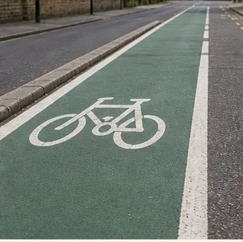A realistic vocabulary image showing a green cycle lane.